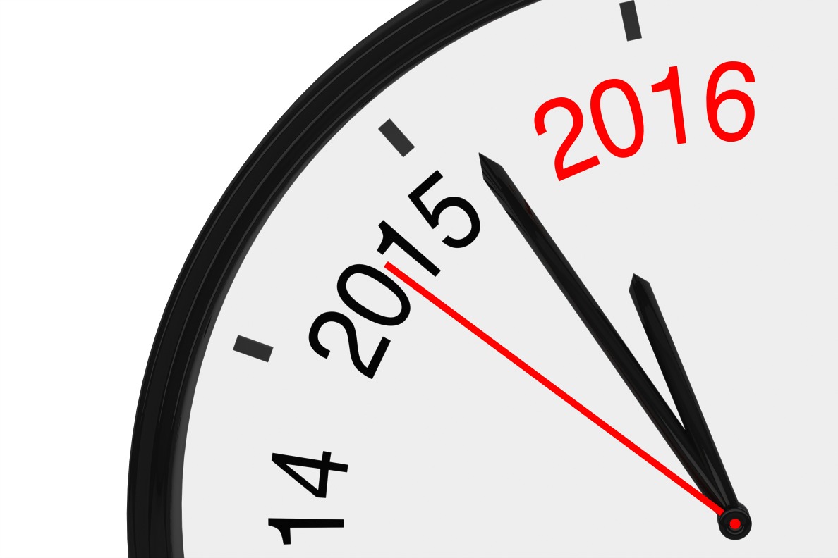 The year 2016 is approaching. 2016 sign with a clock on a white background